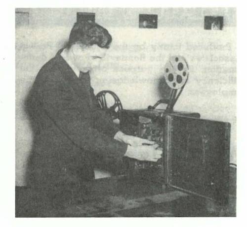 Elmer Buehler with projector_WattsNewsMonthly_Vol1No1_Jan.1943.jpg